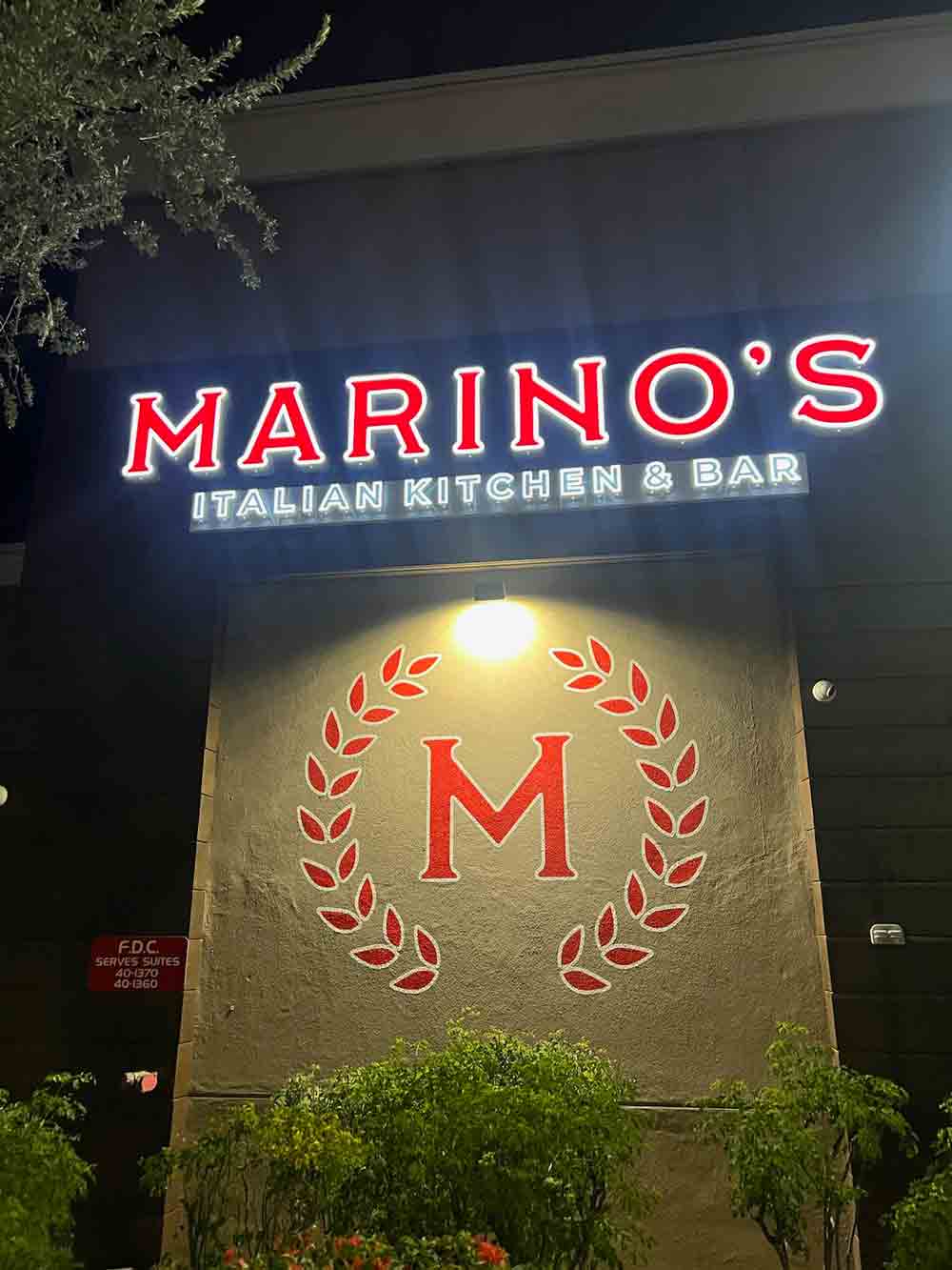 Marino's storefront features a vibrant sign expertly installed by 1 Stop Signs.