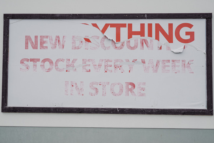 Worn storefront sign being removed for replacement or upgrade in Phoenix, AZ